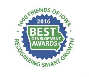 Circular badge showing 1000 Friends of Iowa 2016 Best Development Awards with a map outline of Iowa. The text reads Recognizing Smart Growth.