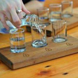 Person pouring water into glasses