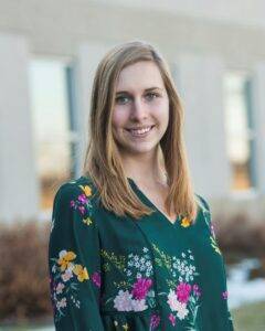 headshot of woman wearing floral shirt