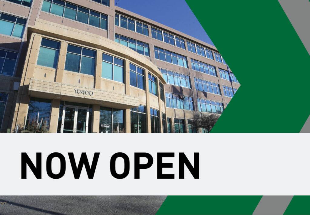 • Front of a building in Eden Prairie, Minnesota with “Now Open” text in front of photo