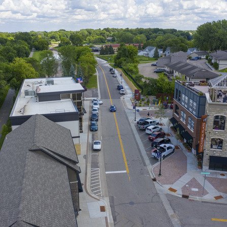 Overhead view of downtown with sidewalks and off-street parking