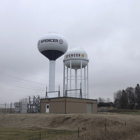 Two water storage towers with a utility building below