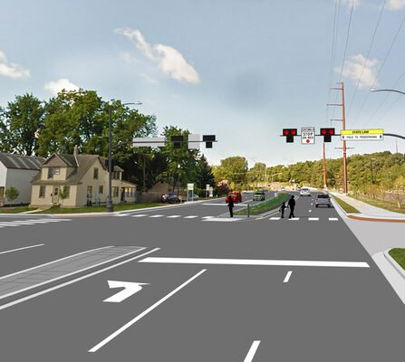 A visual representation of an intersection with cars, stoplights, and pedestrians.