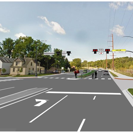 A visual representation of an intersection with cars, stoplights, and pedestrians.