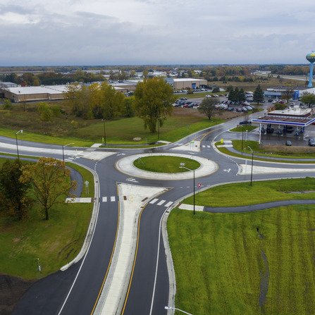Aerial view of a roundabout near a gas station