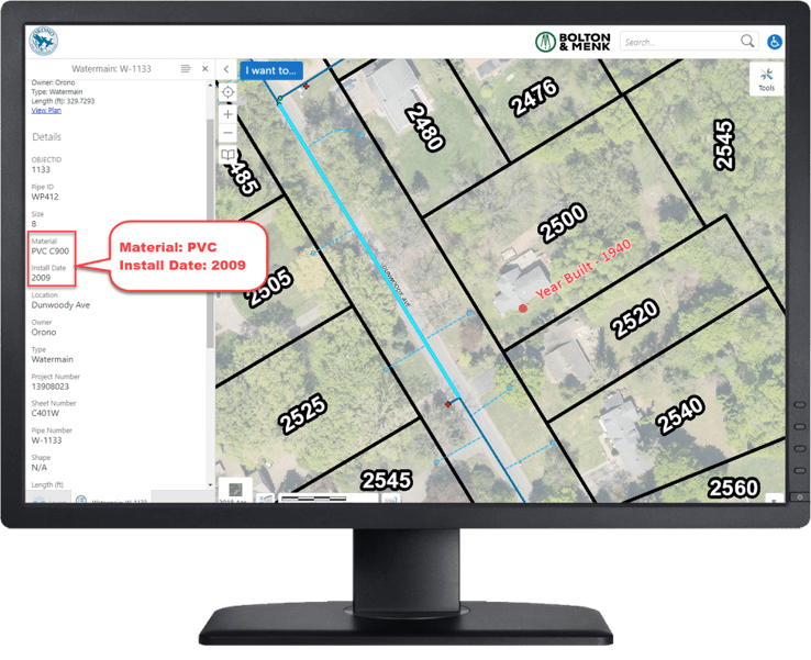 A computer screen displays a map with property lines and lot numbers. A highlighted area shows details: Material: PVC, Install Date: 2009. A property note says Year built: 1940, aiding in understanding the Lead & Copper Rule Revisions and their historical context.