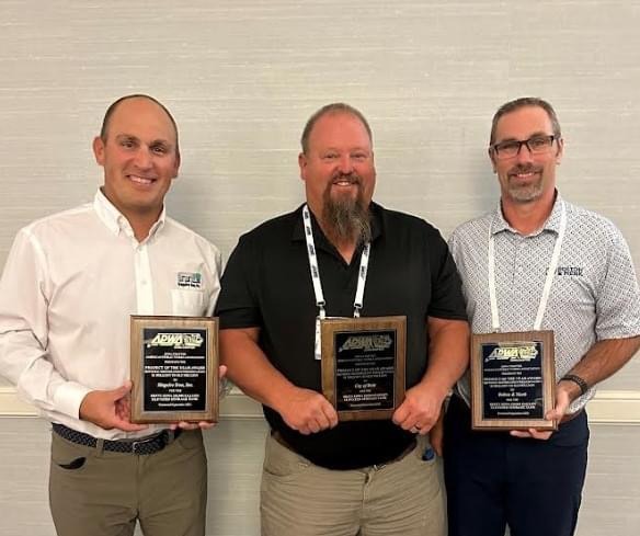 Maguire Iron’s Jake Duggar, City of Britt Public Works Director Vance Hagen, and Bolton & Menk’s Wes Brown with the award