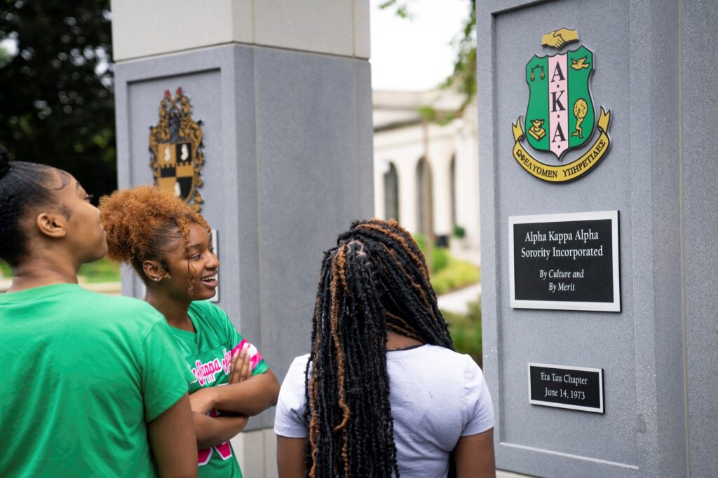 Students admiring the NPHC Plaza