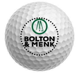 A white golf ball featuring the Bolton & Menk logo, which includes a green circle with stylized letters M inside and the companys name in bold black font below.