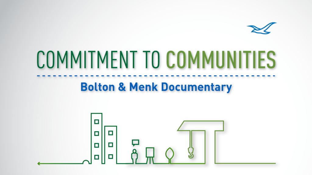 “Commitment to Communities: Bolton & Menk Documentary” text on a white background with simple green line drawings of buildings and infrastructure. Featuring a blue bird in the top right corner, this documentary highlights dedication to community development.