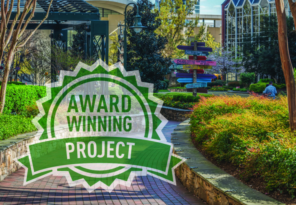 Brick walkway with Charlotte signage at The Green