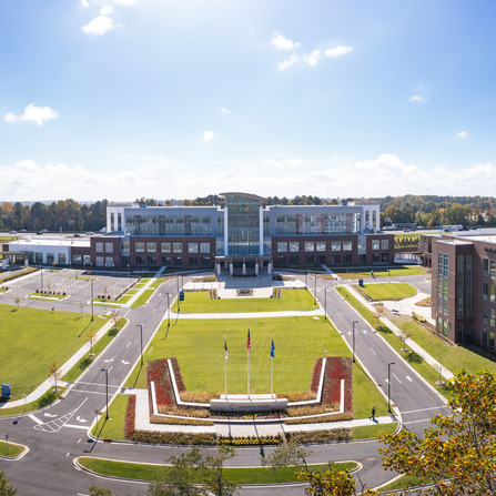 A large building with landscaping and grass